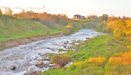 View of the river Tosna at cloud summer evening, Leningrad Region, Russia.の写真素材
