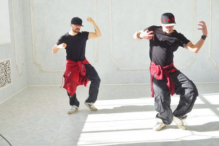 ST.PETERSBURG, RUSSIA - 27 MARCH 2017: Two young men are hip hop dancing. in a bright studio. Project Dancing Petersburg.のeditorial素材