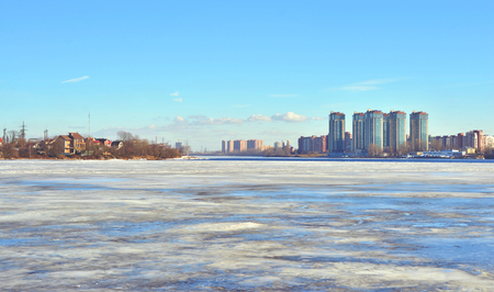 View of Neva river and microdistrict Ribatskoe on the outskirts of St. Petersburg at winter day, Russia.の写真素材