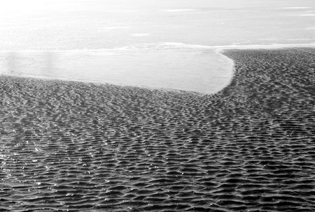 Ice and water, it can be used as background. Black and white.