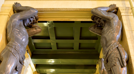 Building of New Hermitage with statues of Atlanteans in center of St.Petersburg at night, Russia.のeditorial素材