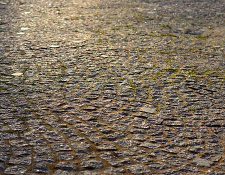 Cobblestone sidewalk made of small stones, can be used as a background.の写真素材