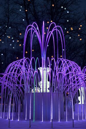 SAINT PETERSBURG, RUSSIA - 23 DECEMBER 2018: The fountain is decorated with garlands for the New Year in Petersburg at night.のeditorial素材
