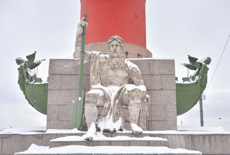 Statue of allegory of the Dnieper river at the base of the Rostral Column in St.Petersburg, Russia.の写真素材