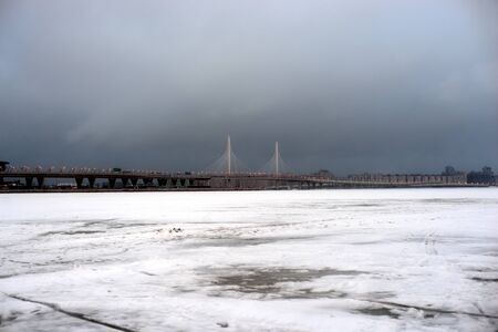 ST.PETERSBURG, RUSSIA - 2 JANUARY 2019: Frozen Gulf of Finland of Baltic Sea and Western High Speed Diameter at cloud winter day.のeditorial素材