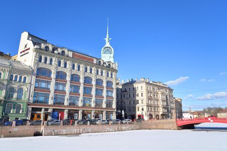 ST.PETERSBURG, RUSSIA - 27 MARCH 2019: View of the embankment of Moika river and the Esders and Scheefhals building in historical center of St.Petersburg.のeditorial素材