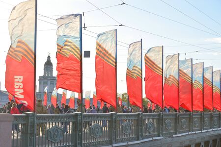ST.PETERSBURG, RUSSIA: - MAY 9, 2019: Residents of St.Petersburg walk on Palace Bridge on Victory...