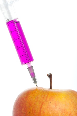 Syringe with colour injection isolated on whiteの写真素材