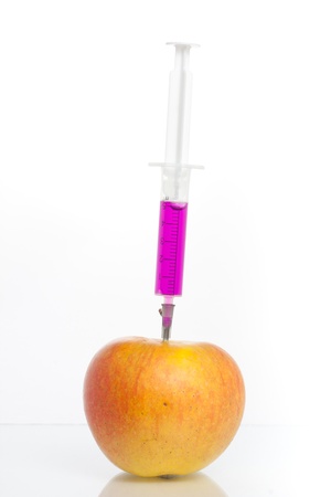 Syringe with colour injection isolated on whiteの写真素材
