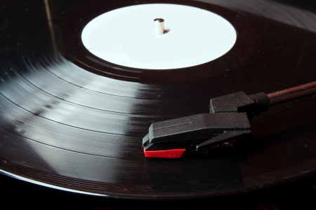 Record player with focus on the head of the player