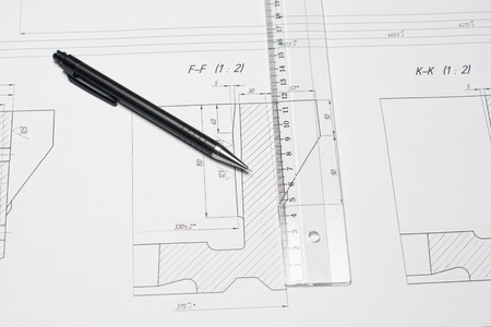 Pencil and ruler on the open blueprint