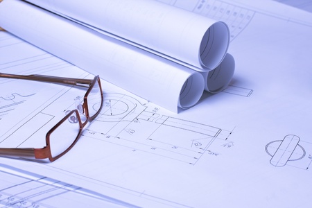 Rolled Blueprints, glasses and ruler on architectの写真素材