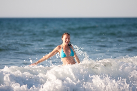beauty and sexy woman having fun in waterの写真素材
