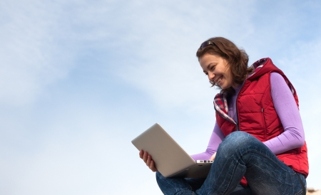 Young woman working with her laptopの写真素材