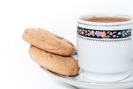 A cup of coffee with cookies on white background 