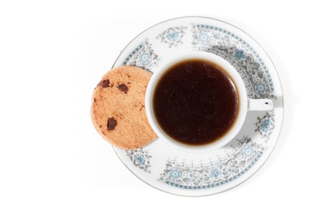 A cup of coffee with cookies on white background の写真素材