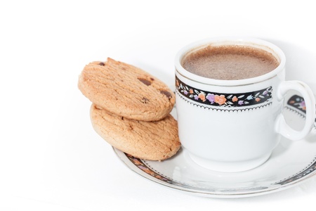 A cup of coffee with cookies on white background の写真素材