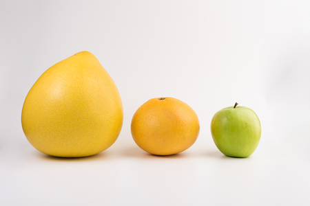 pomelo, apple and grapefruit isolated  on white backgroundの写真素材