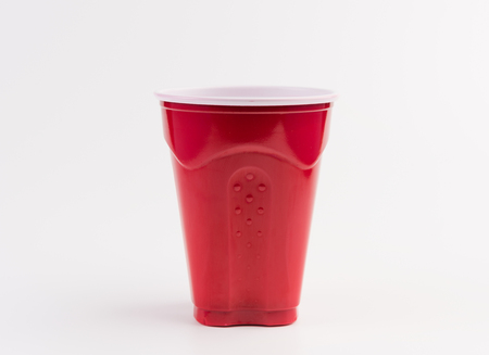 Empty red plastic cup isolated on white