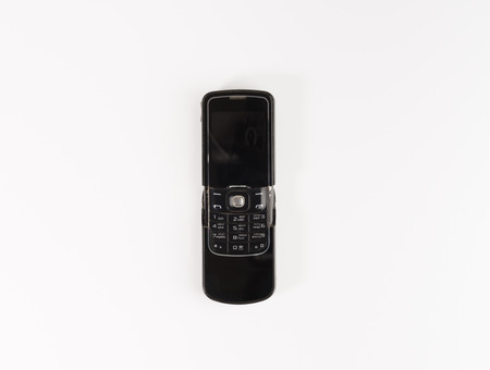 Old mobile phone isolated on white background