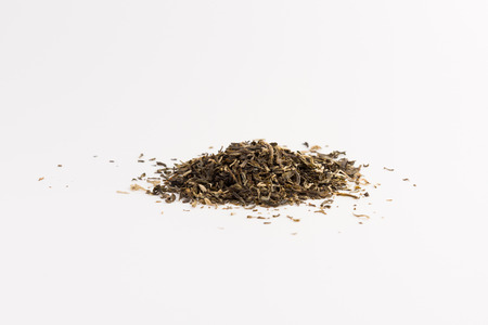 Pile of green tea isolated on white backgroundの写真素材