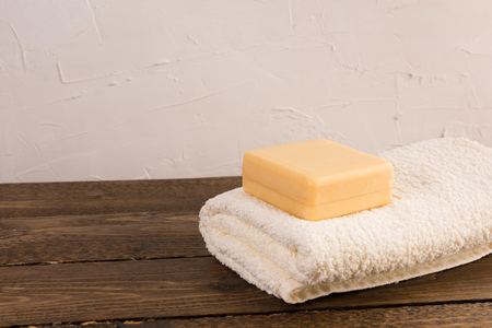 soap and towel on a wooden shelf in the bathroom. Interior of bathroom.の写真素材
