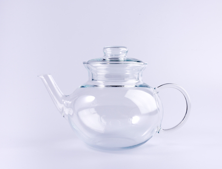 empty transparent teapot isolated on white backgroundの写真素材
