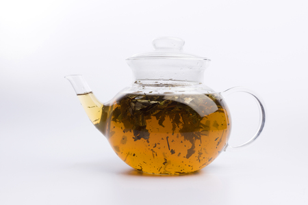 Glass teapot with herbal tea isolated on white backgroundの写真素材