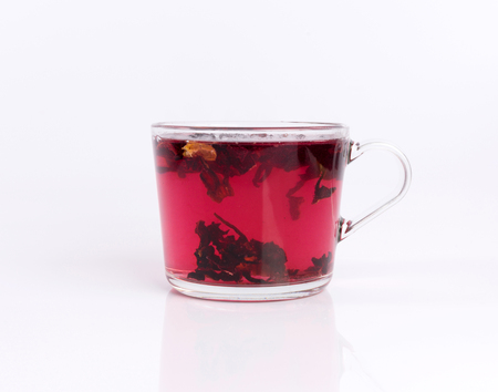 hibiscus tea in the glass cup isolated on white backgroundの写真素材