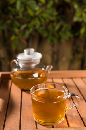 Composition with green tea on wooden table outdoors. Weight loss concept, nature backgroundの写真素材