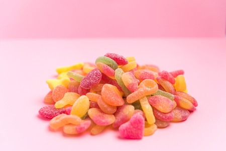 sugary jellies isolated on a pink backgroundの写真素材