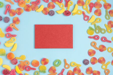 Blue paper background with sweets and blank notepad. Place for your text. Cozy sweet backgroundの写真素材
