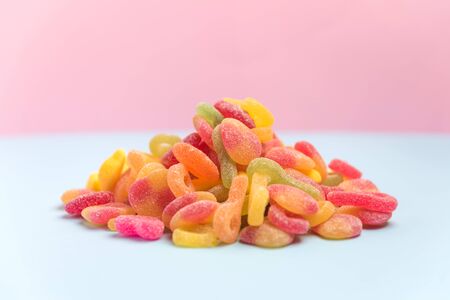 sugary candies isolated on a pink backgroundの写真素材
