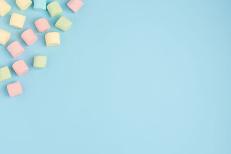 Marshmallow on blue colour background. Cozy sweet backgroundの写真素材
