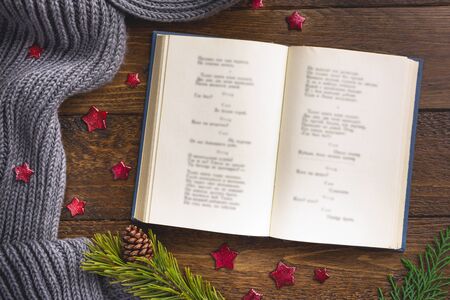 Christmas theme background with scarf, cup of coffe and decoration on dark wood table. Creative Flat layout and top view compositionの写真素材