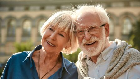 I am gonna love you all my life. Happy senior couple smiling while spending time together outdoorsの写真素材