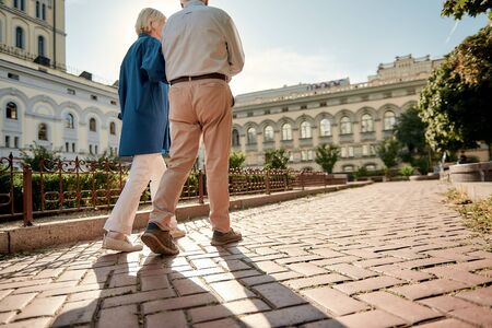 Traveling. Elderly stylish couple walking together outdoors. Family. Love conceptの写真素材
