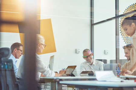 Achieving best results together. Business people having a meeting in the modern office, working together on a new projectの写真素材