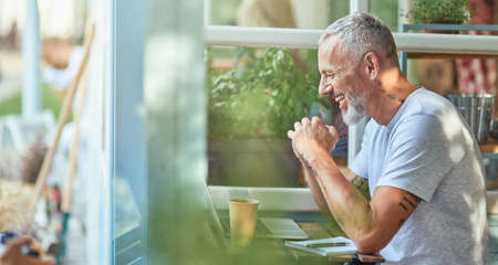 Middle aged caucasian businessman working on terraceの写真素材