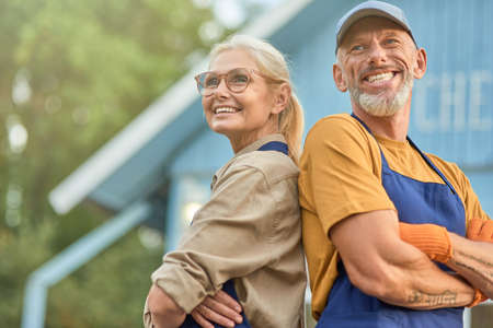 Middle aged caucasian couple on garden house backgroundの写真素材