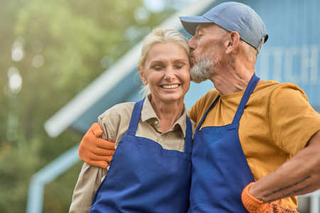 Loving middle aged caucasian couple kissing and smilingの写真素材
