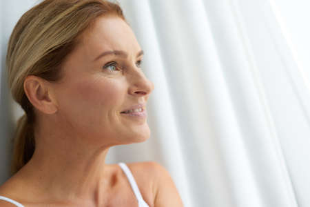 Smiling mature Caucasian lady with healthy hair and skinの写真素材