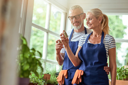 Middle aged caucasian couple looking at dried herbsの写真素材