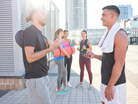Handsome young caucasian sportsmen talkingの写真素材