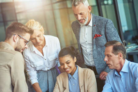 Business team. Group of multiracial colleagues working together in the modern officeの写真素材
