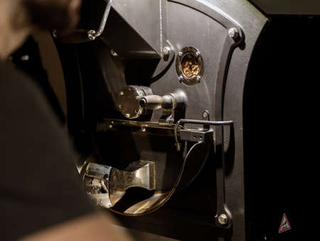 Modern coffee roasting machine with various metal partsの写真素材