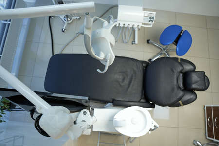 Vacant up-to-date dental chair at dentist officeの写真素材