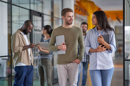 Employees going to meeting with experienced mentor