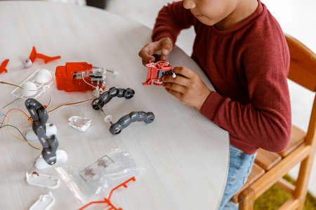 Boy constructing model with constructor details in schoolの写真素材