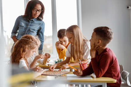 Kids training analytical and creative skills in classroomの写真素材
